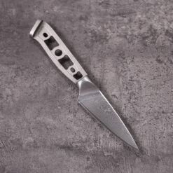 Unfinished paring knife blade blank featuring wavy Damascus pattern and minimalist handle