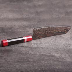 Copper Damascus Kiritsuke Bunka knife with dark wood handle and accents