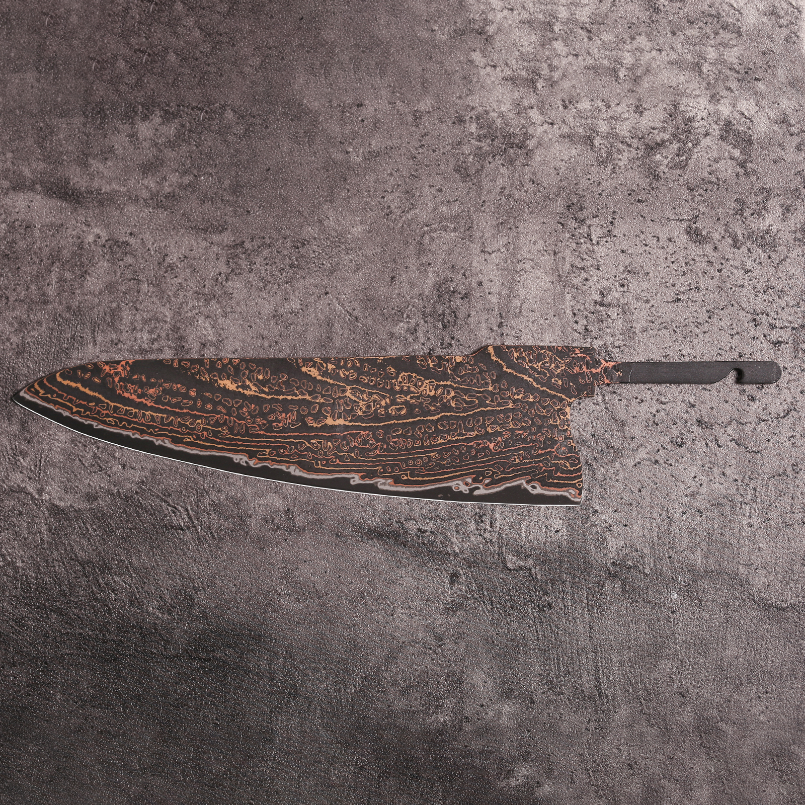 Copper Mai Damascus steel chef knife blank with swirling layered pattern
