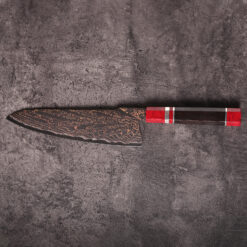 close-up of damascus wave pattern on copper mai chef knife blade