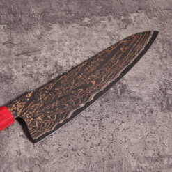 hand-forged damascus steel chef knife with copper shimmer and wood handle