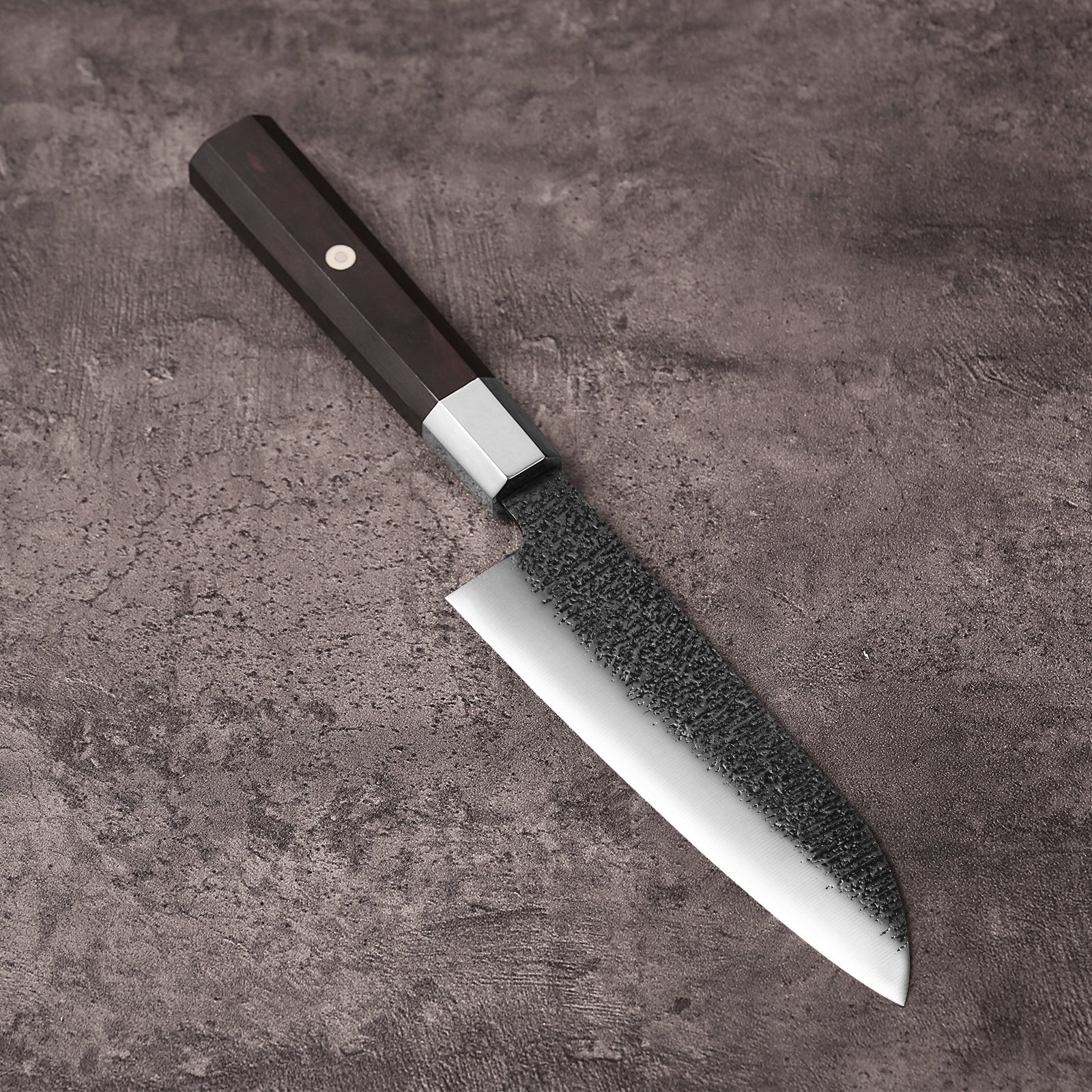 AUS-10 santoku knife on grey stone showing the 165mm blade and octagonal ebony handle