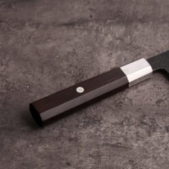 Octagonal ebony wa handle with 410 stainless cap and white pin on the AUS-10 santoku